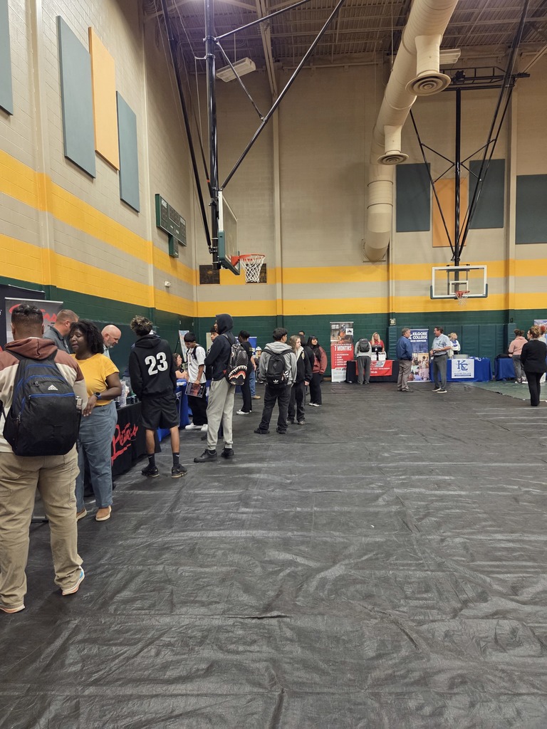 Students interacting with various career booths