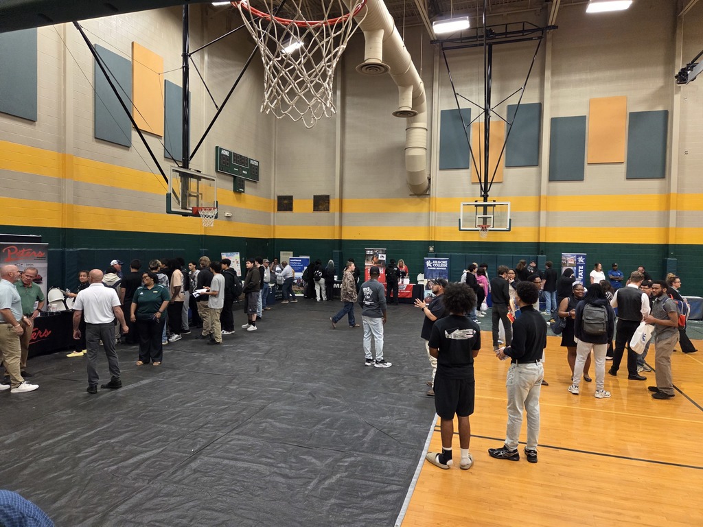 Students interacting with various career booths