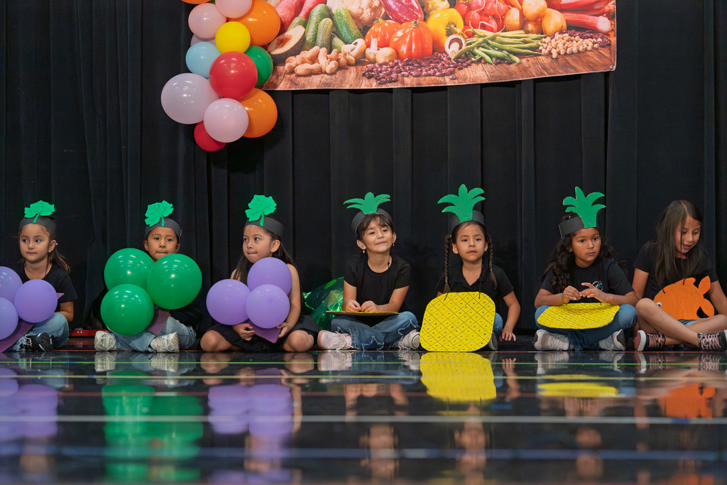 kids on stage dressed as fruits