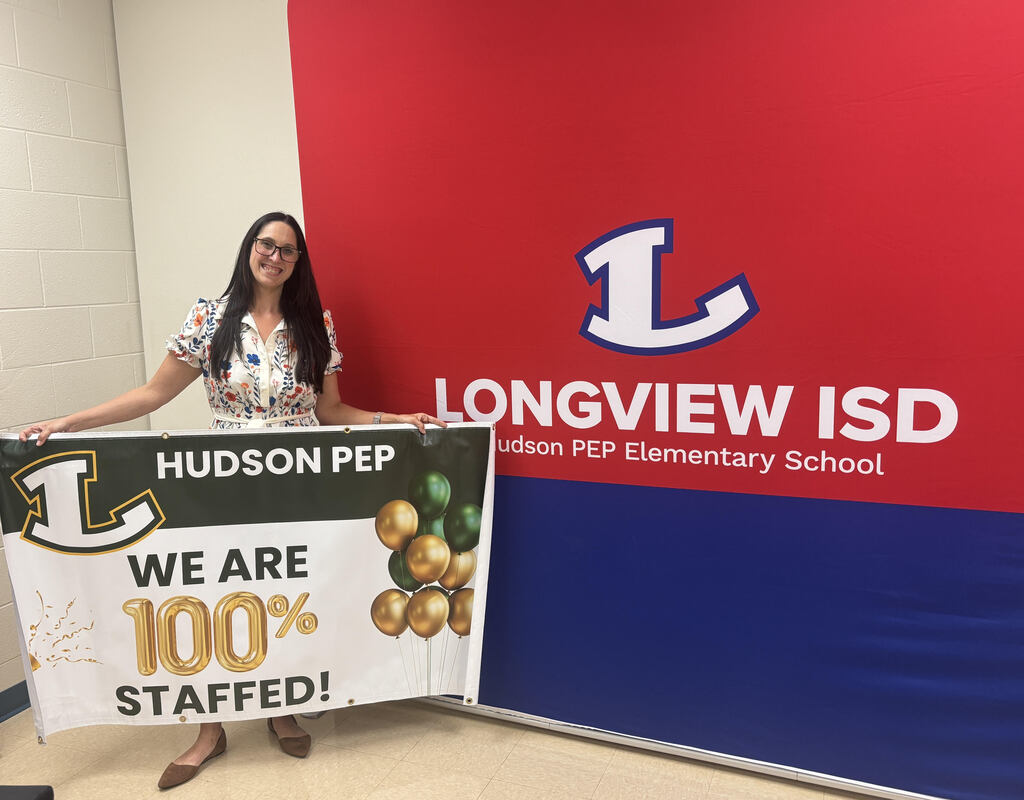 Campus principal holds "100% staffed" Banner