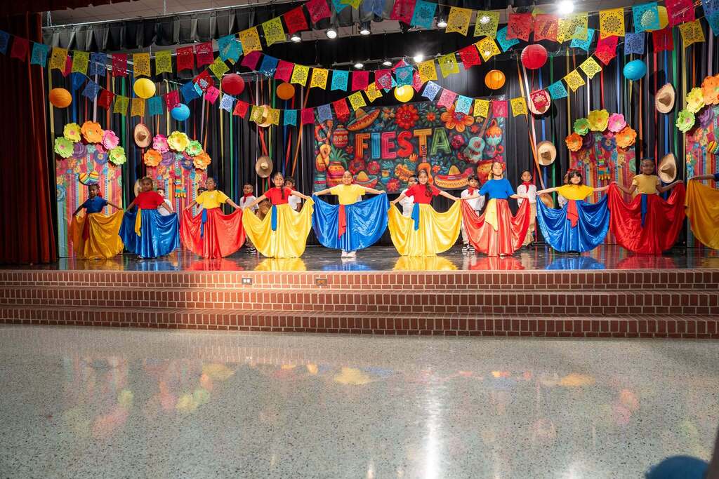 Students performing for hispanic heritage month