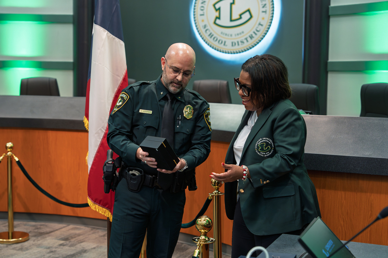 Sheppard being given badge