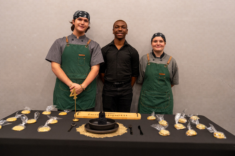 Culinary students show some of their baked goods.