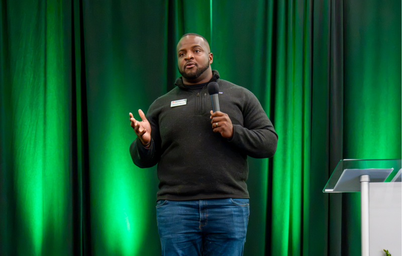 Mentoring Alliance’s De’Onte Garrett talks to the attendees at State of the District.