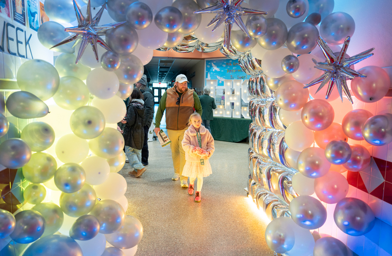 student walking through portal