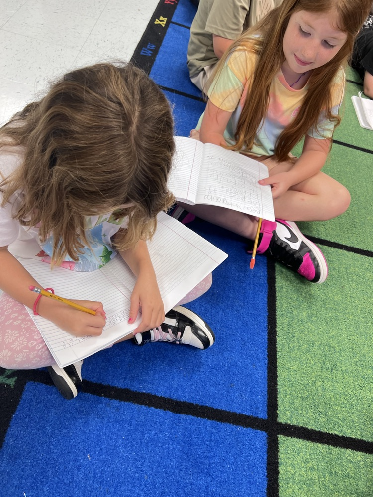 two students on carpet