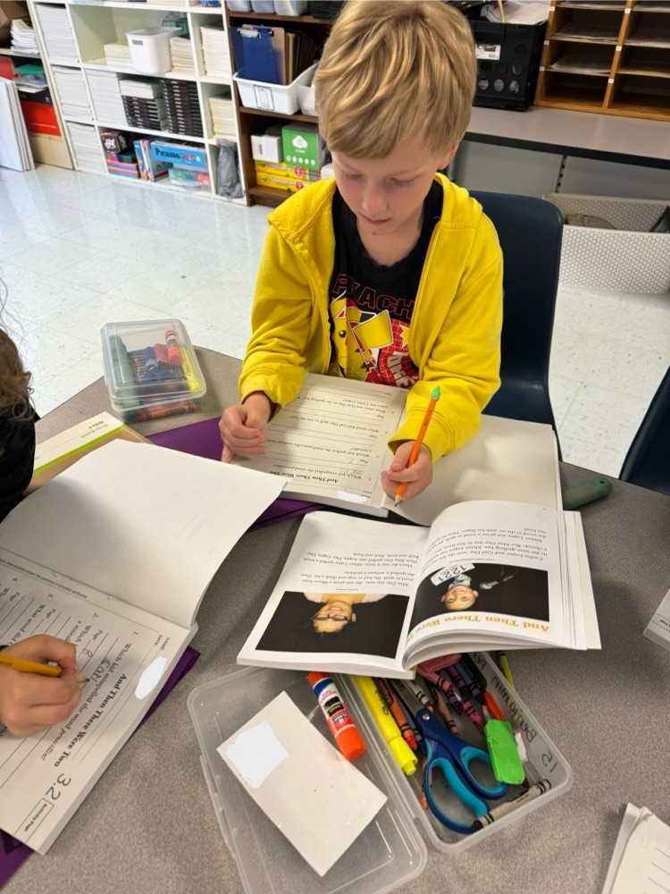 student reading and working