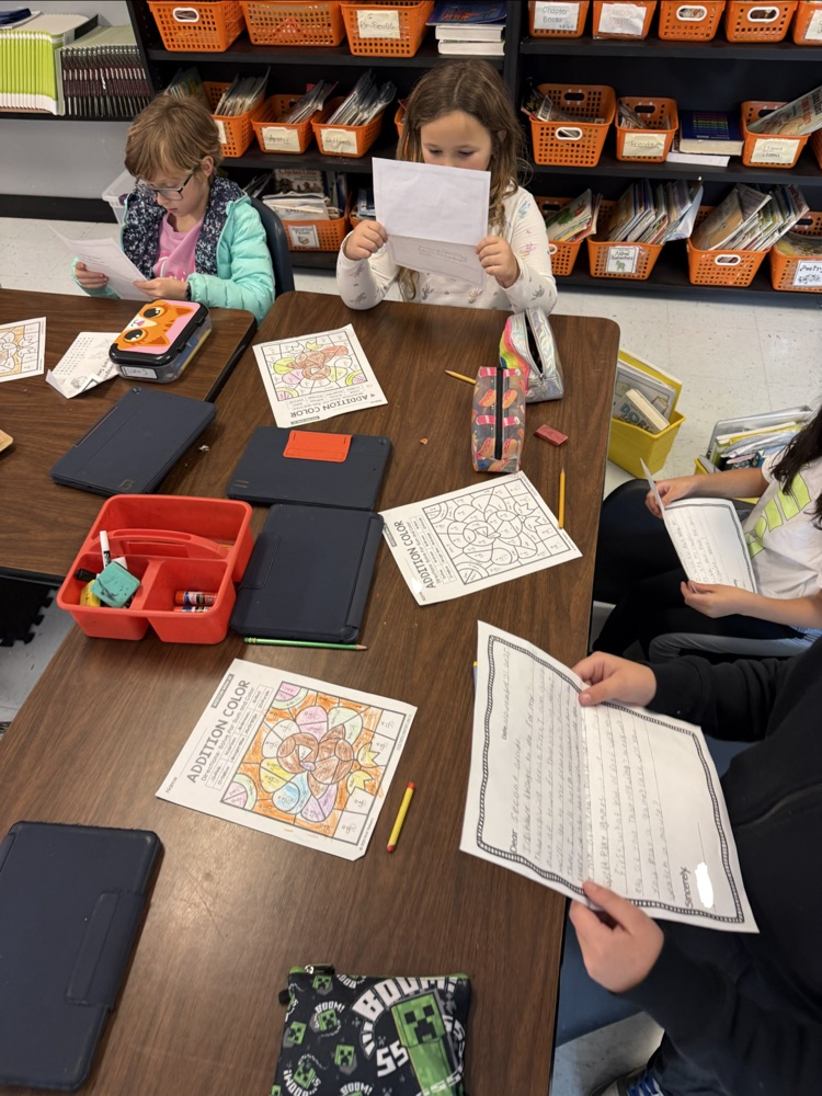 students reading their letters