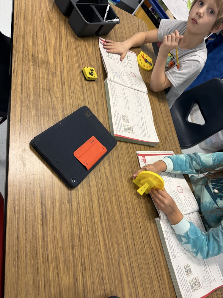 students telling time