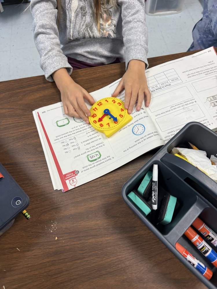 students telling time