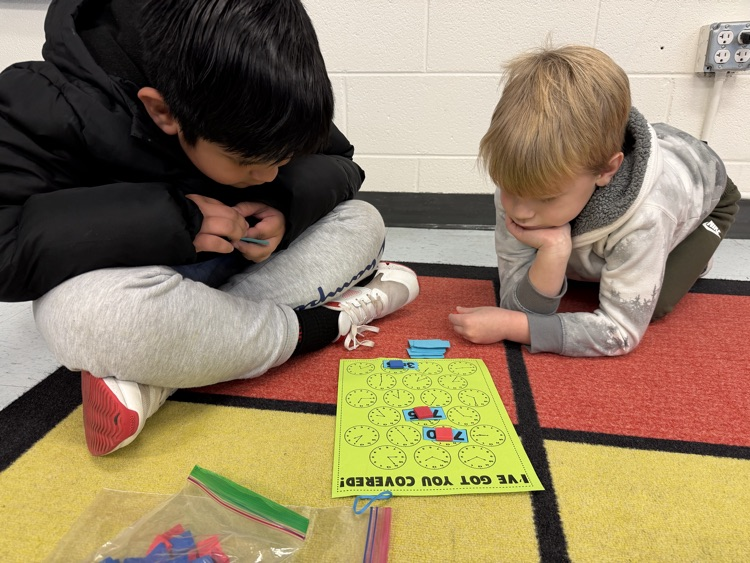 students telling time