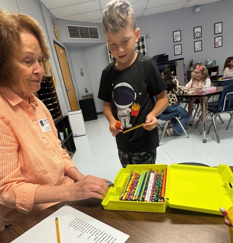 volunteer working with students