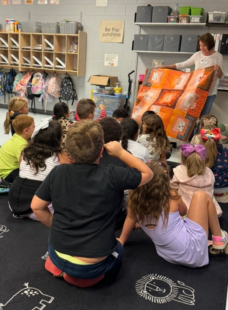 volunteer working with students