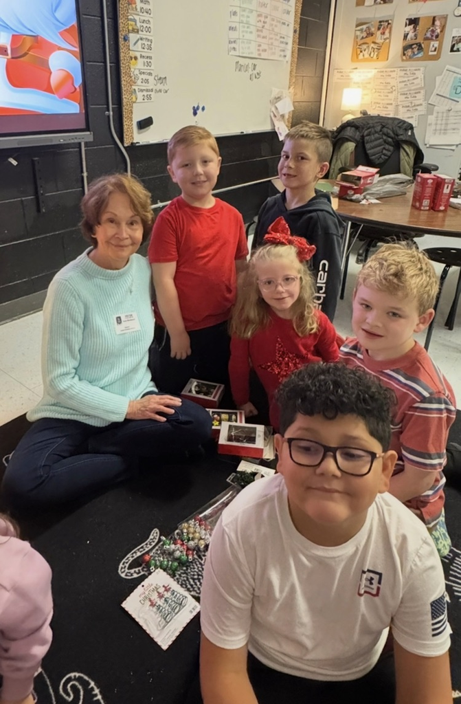 volunteer smiling with students