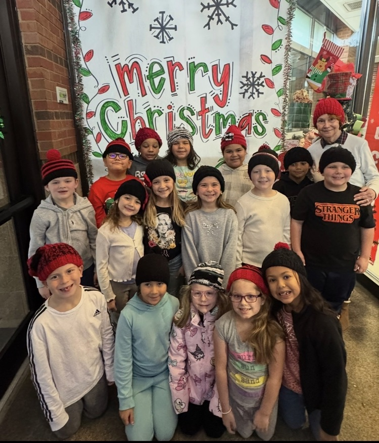 volunteer smiling with students