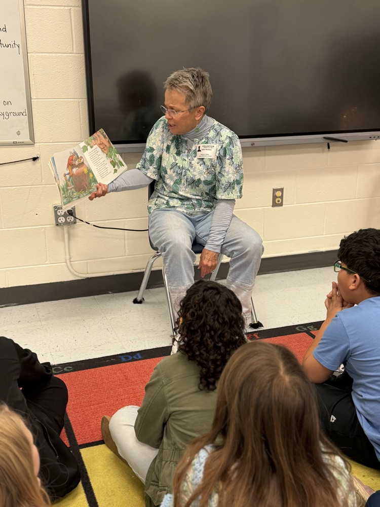 volunteer reading to students