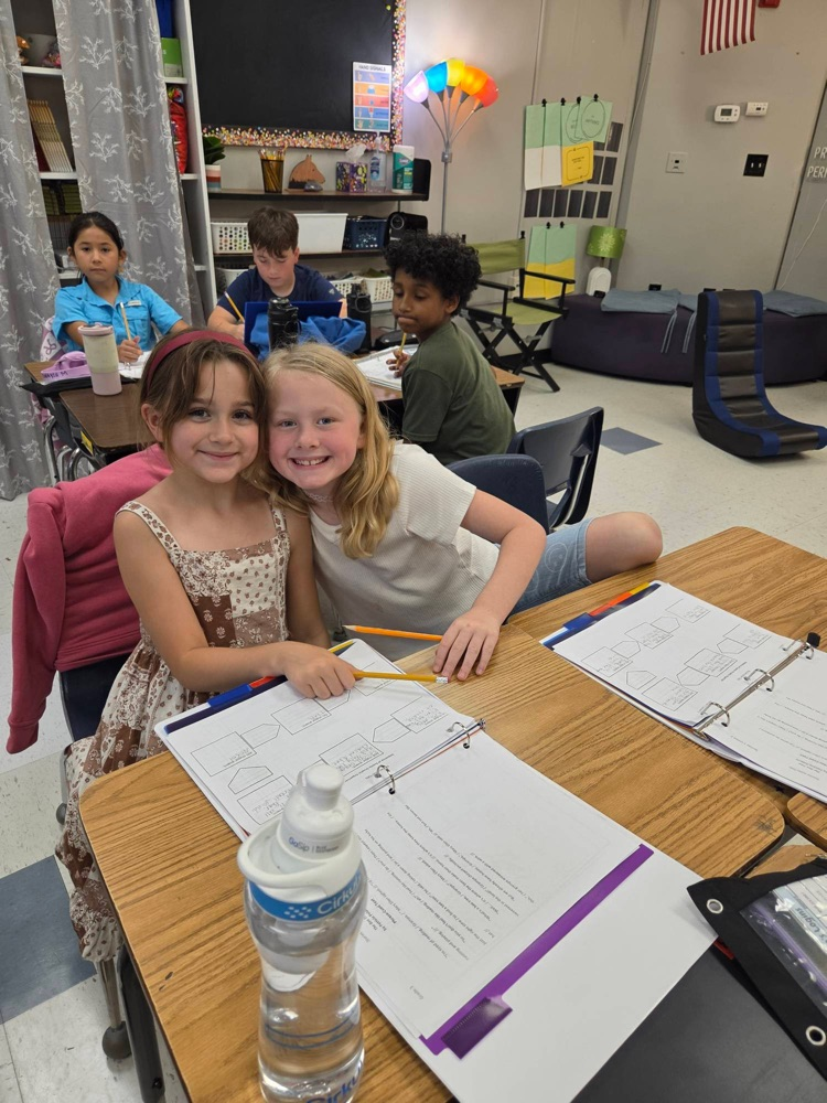 two girls smiling 