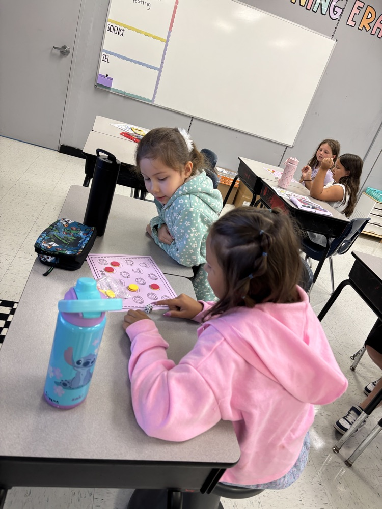 students playing addition review game 