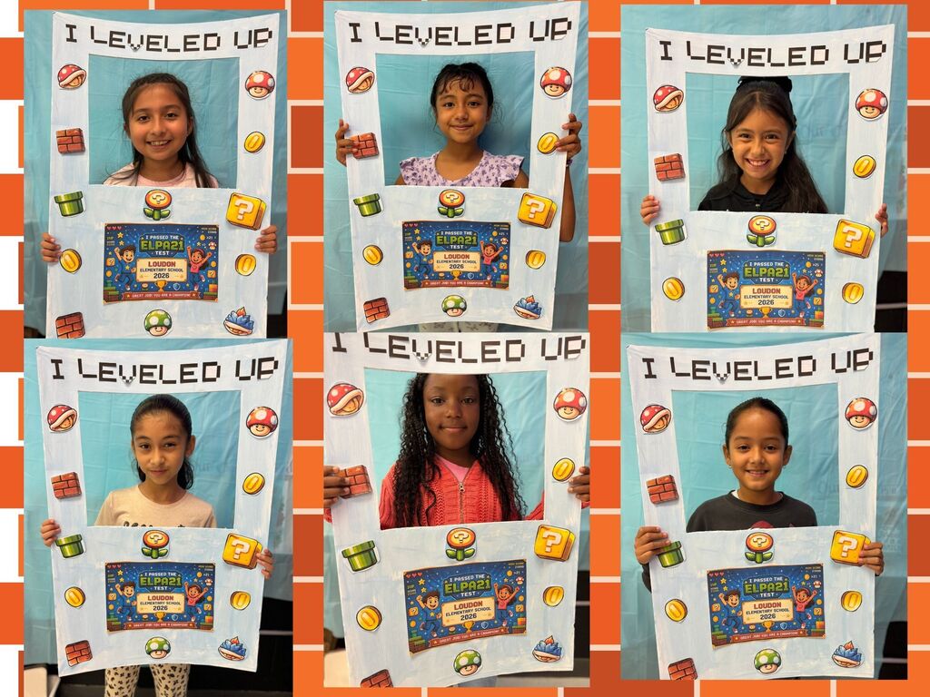 Multiple children hold signs that say "I Leveled Up" with colorful graphics and a brick wall background.