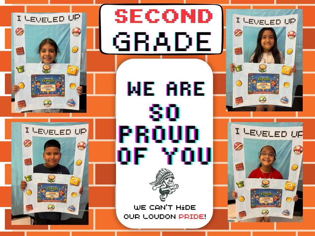 Multiple children in second grade display signs with the message "We are so proud of you" against an orange brick wall.