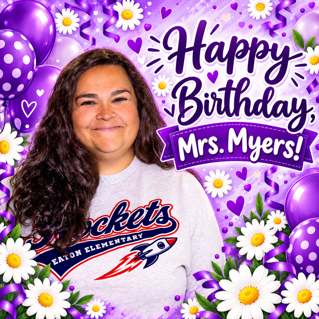 A woman with long curly hair smiles, wearing a white shirt with "Rockets" on it. Bright balloons and flowers behind her.