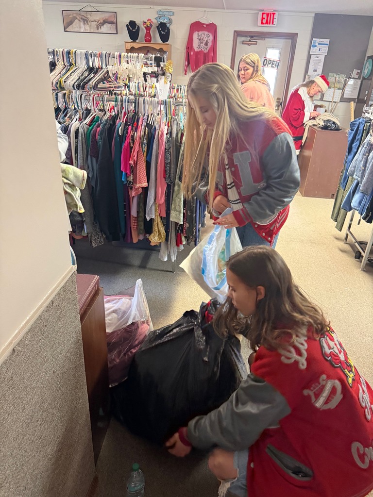 Students assisting with bags
