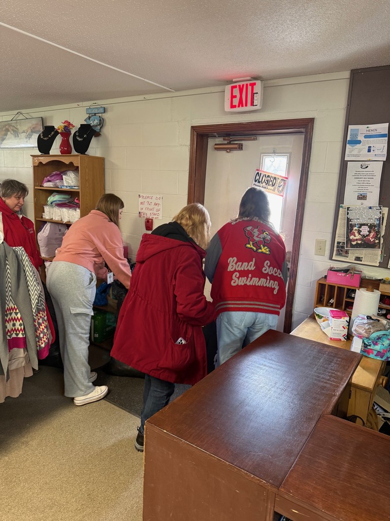 Students assisting with bags