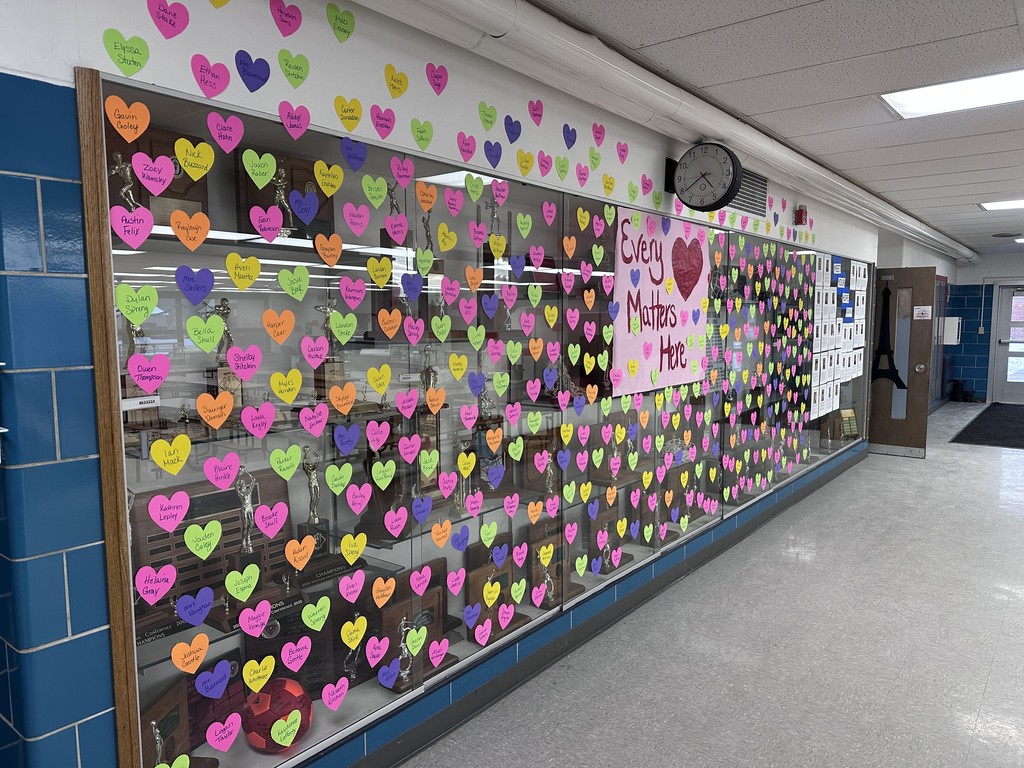 Photo of hearts with names hanging on the hallway walls. 