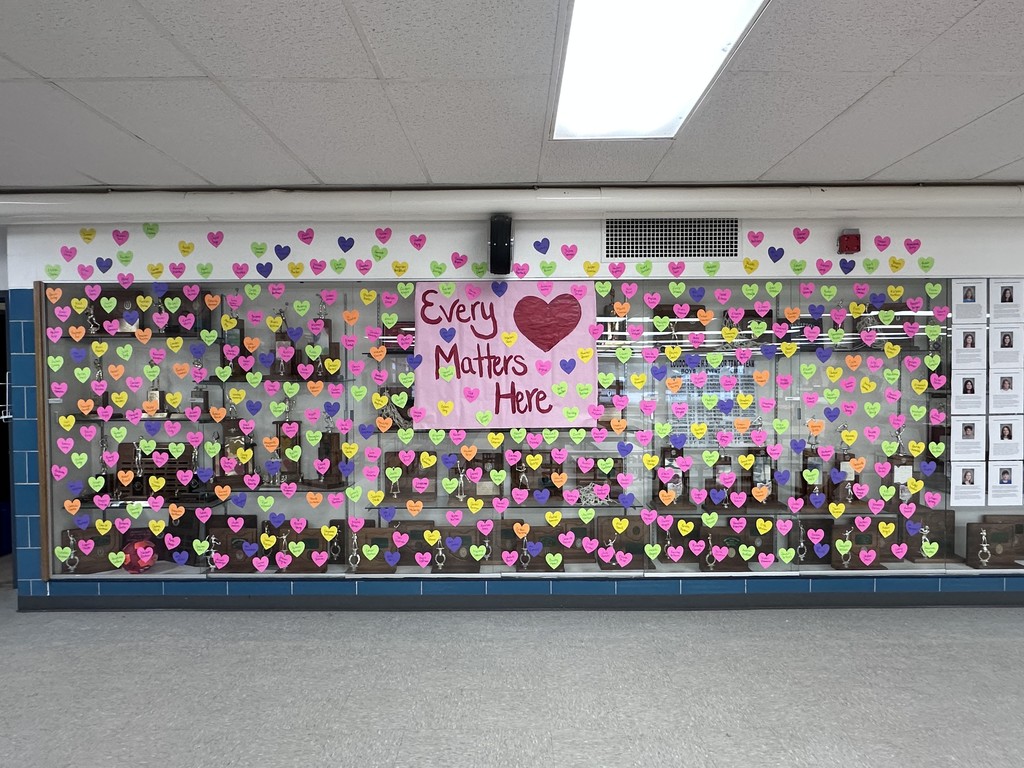 Photo of hearts with names hanging on the hallway walls. 