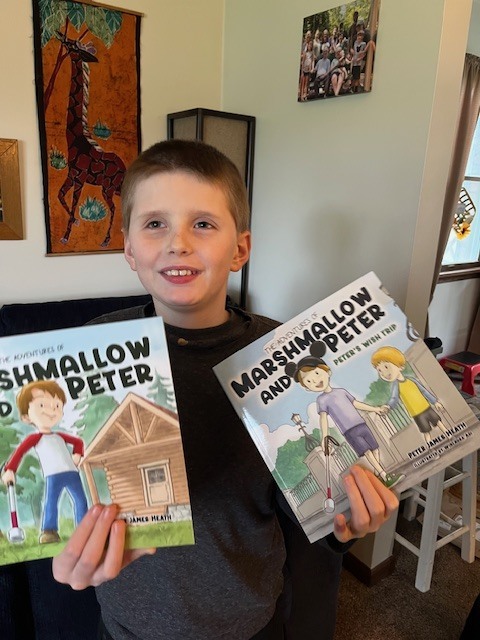 photo of Peter holding books