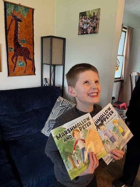 Peter holding books