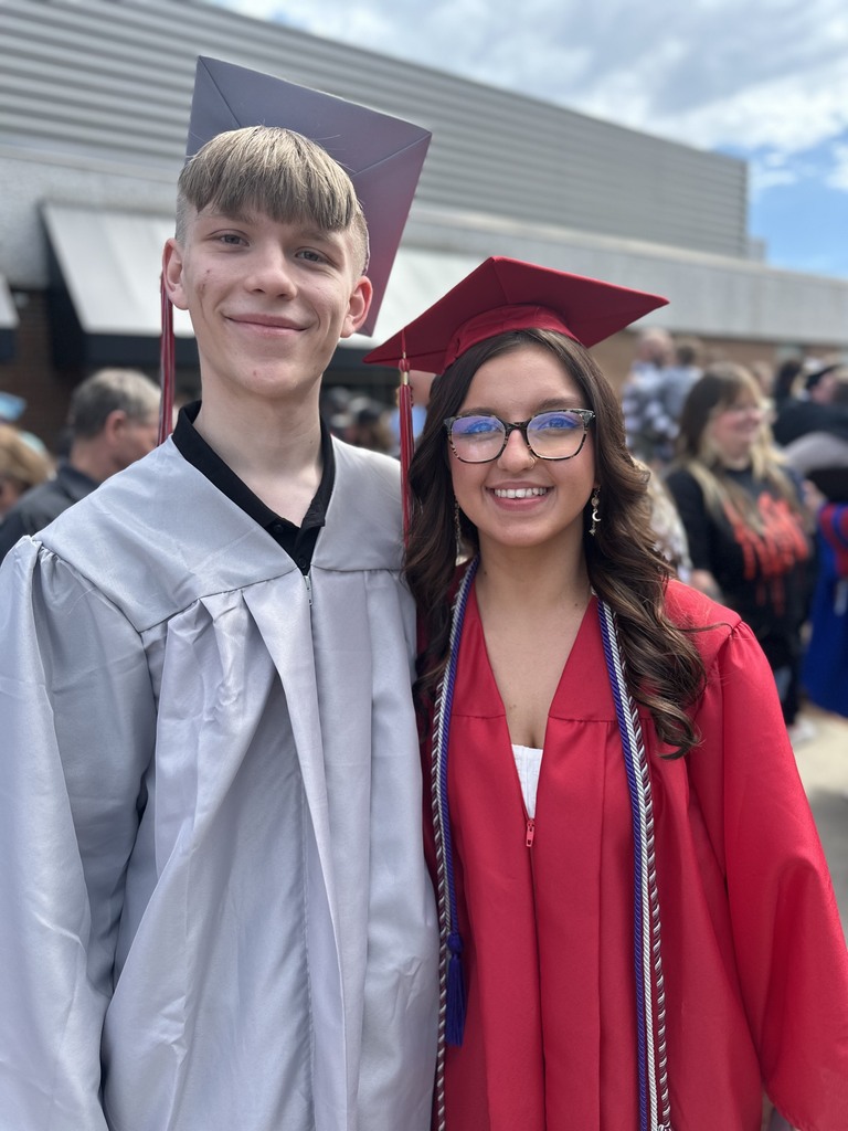 photo of one male and one female graduate
