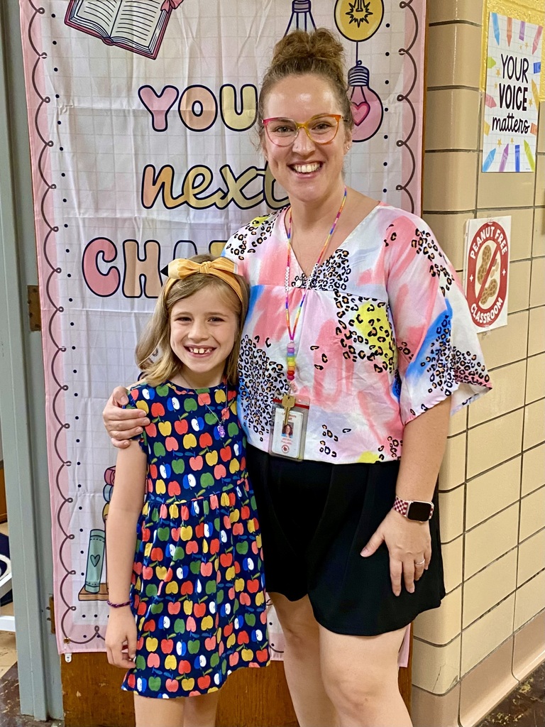 Student and teacher posed for a photo.