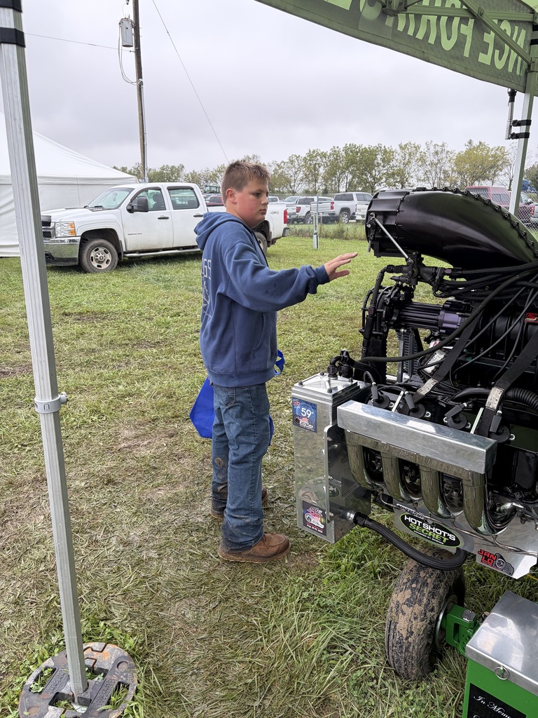 Student exploring ag equipment. 