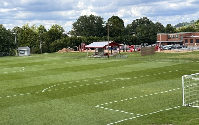 Photo of the soccer field after the turf has been laid 