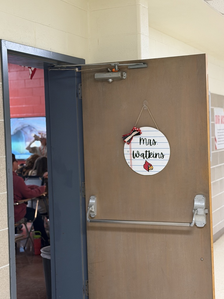 Photo of a classroom door with a hidden pumpkin.