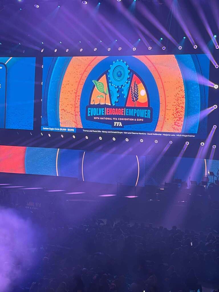 Photo of the conference logo on the convention center screen.