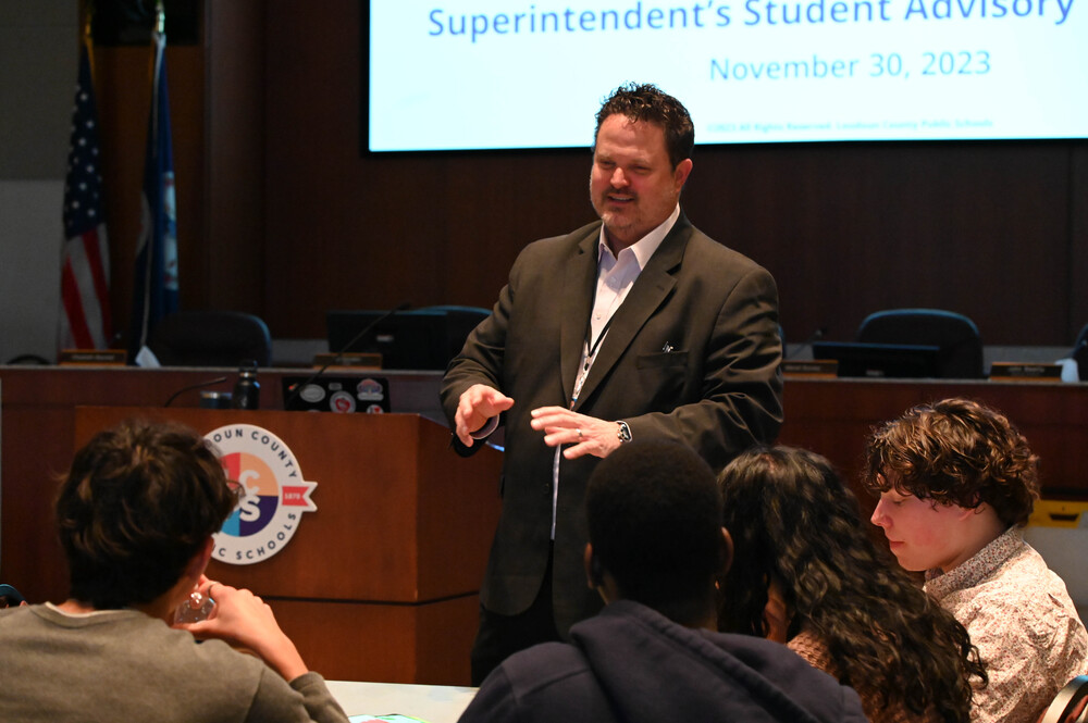 Dr. Aaron Spence talking to students