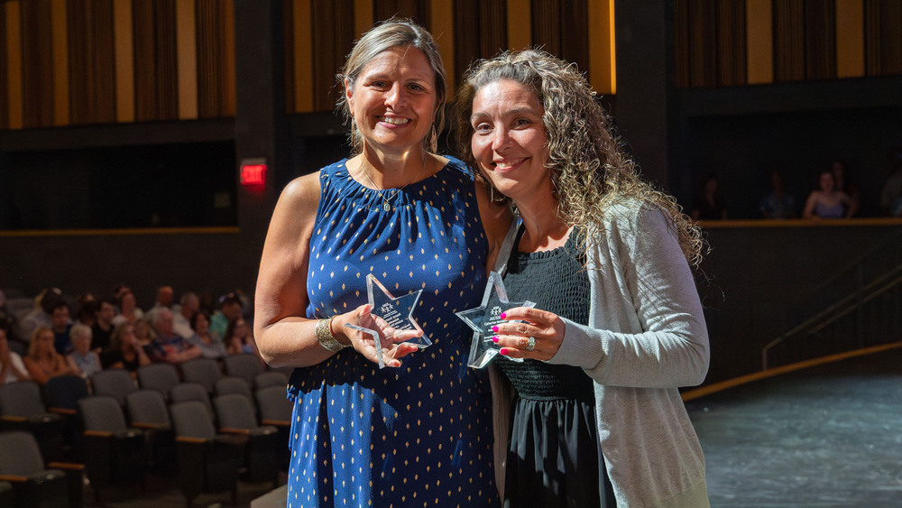 Award recipients pose with star-shaped trophies during the annual SEAC Awards Ceremony.