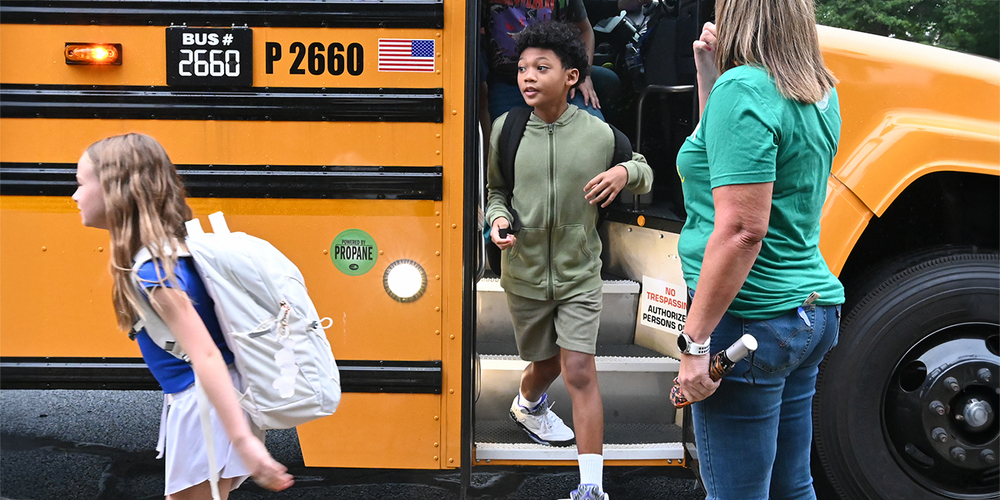 Students walking off a school bus