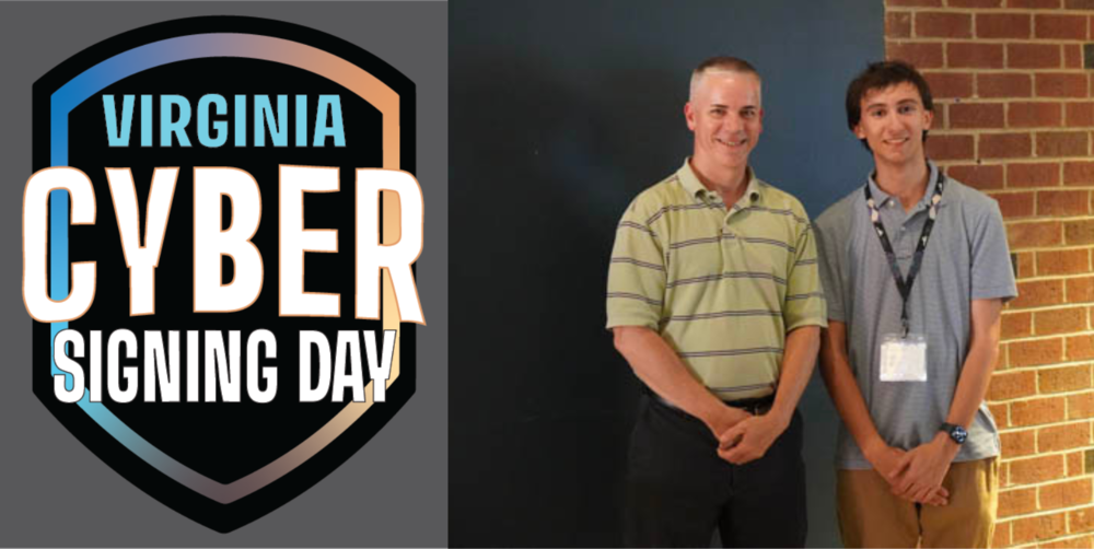 Virginia Cyber Signing Day. Daniel Mayer posing with another person in a hallway.