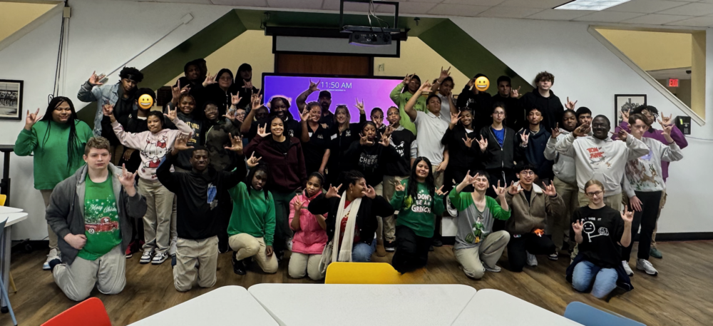Group of students with GSAS staff signing ILY
