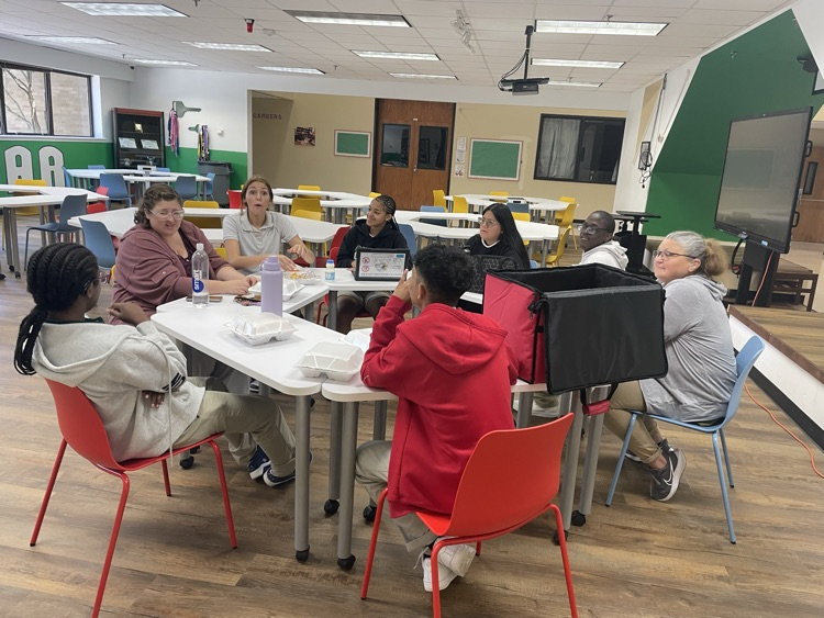 students in common area eating
