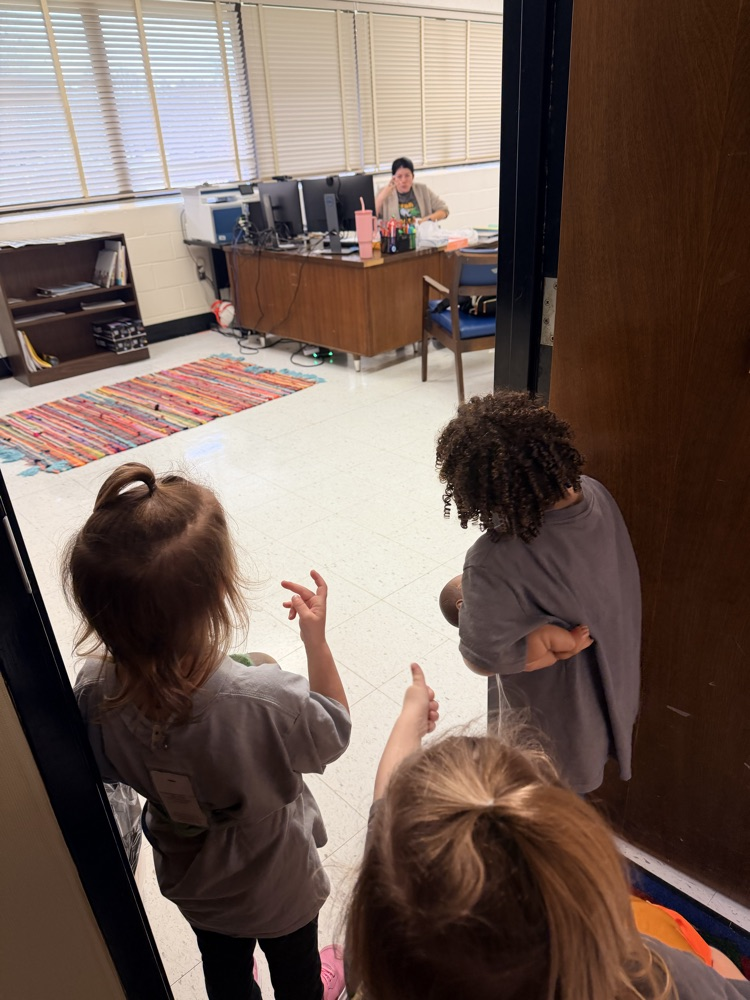 students standing at a doorway