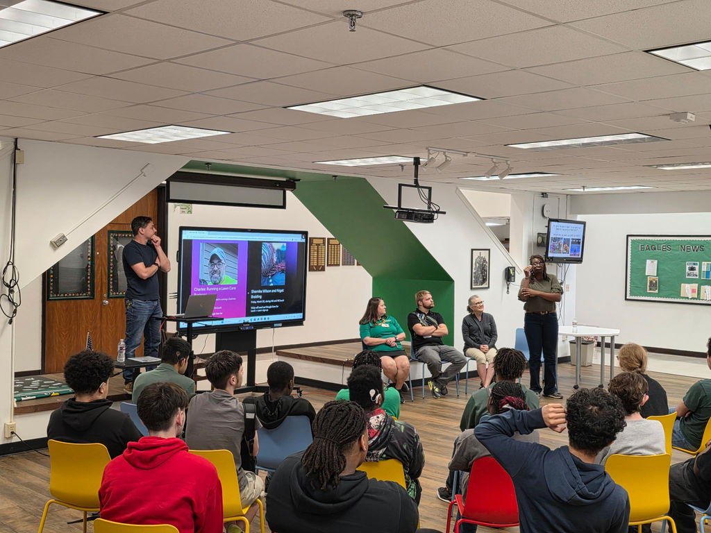 Career day presenters with students sitting