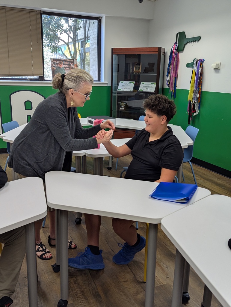 Career day presenter chatting with student
