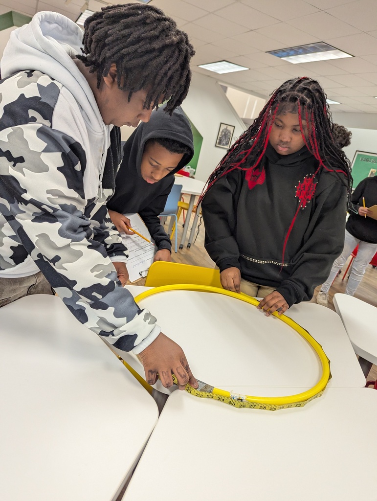 Students measuring a hula hoop
