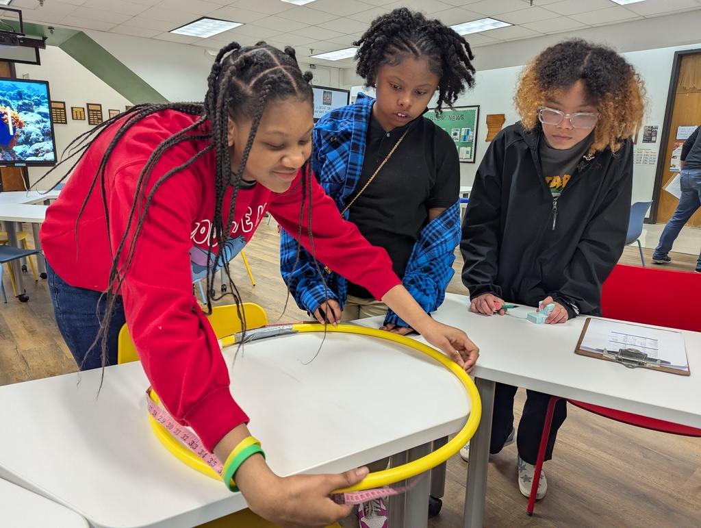 Students measuring a hula hoop