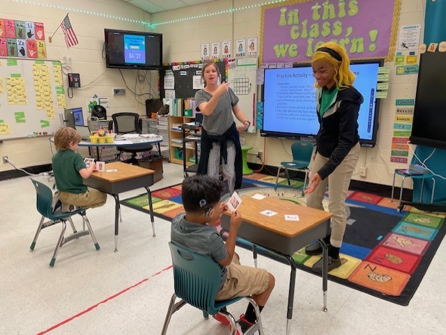 Teacher and intern teaching students