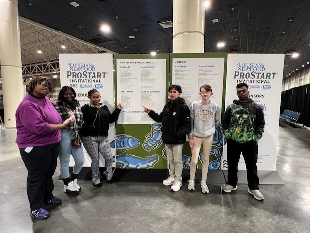 Students standing in front of the prostart invitational sign